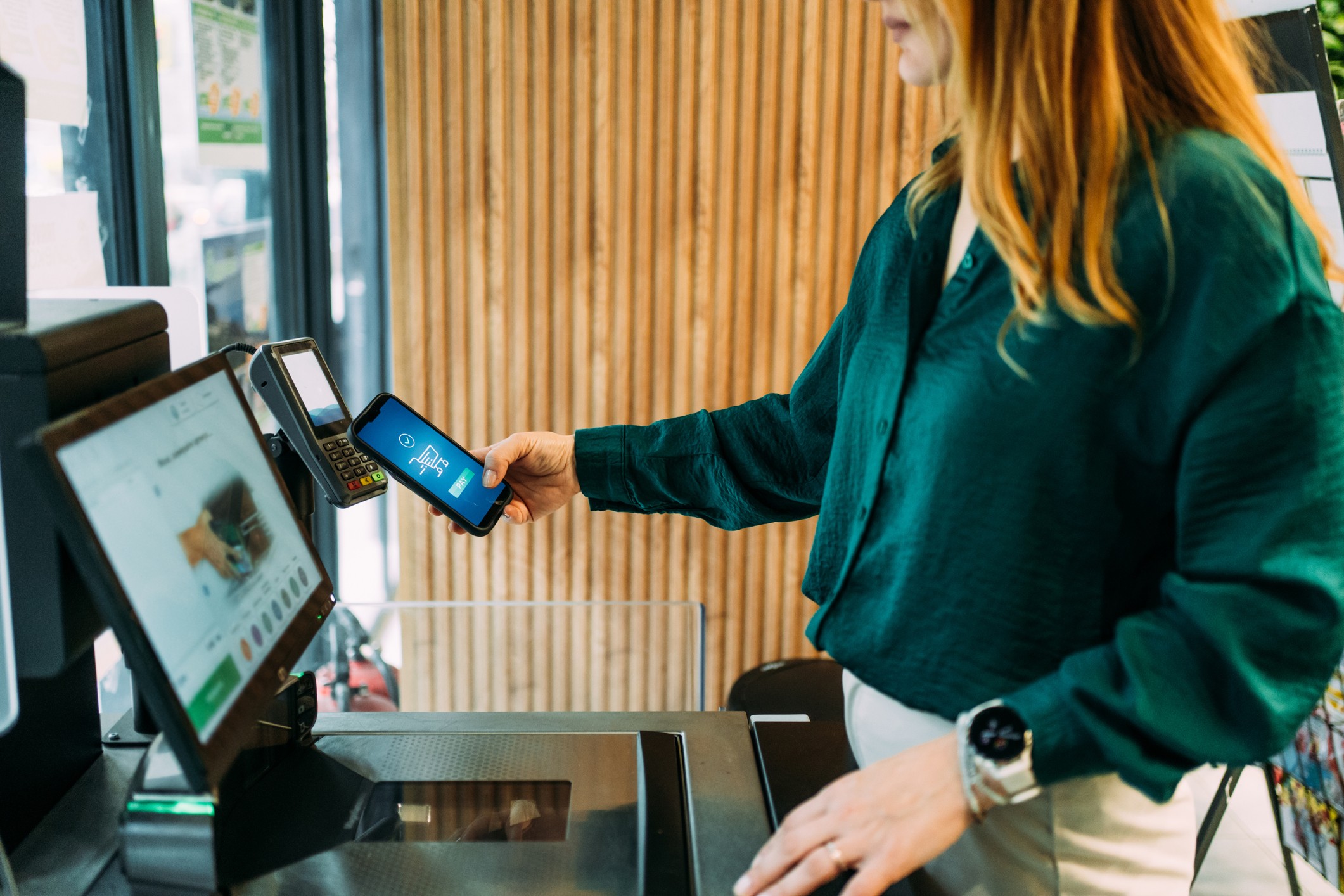 Person sitting on floor working on laptop
